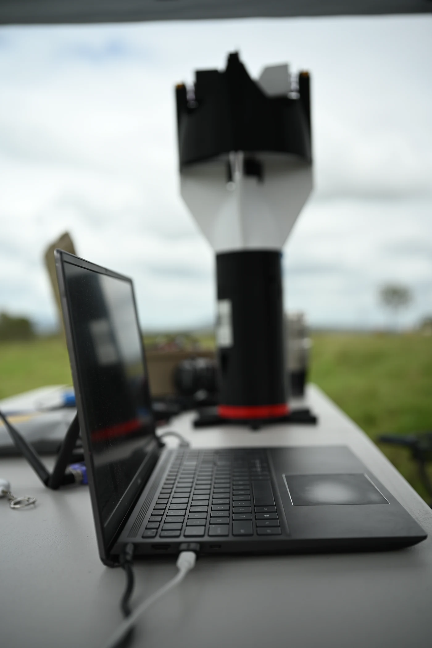 An EP250 aircraft and field ground-control equipment during testing